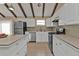 Modern kitchen with white cabinets, stainless steel appliances, and an island at 3114 Magdalina Dr, Punta Gorda, FL 33950