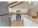 Modern kitchen with white cabinets and stainless steel appliances at 3114 Magdalina Dr, Punta Gorda, FL 33950
