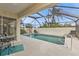 Inviting screened pool with patio furniture at 3114 Magdalina Dr, Punta Gorda, FL 33950