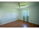 Bright bedroom featuring wood floors and ceiling fan at 3255 Lake View Blvd, Port Charlotte, FL 33948