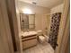 Bathroom with tub, toilet and vanity at 3271 Eldorado Ln, Port Charlotte, FL 33948