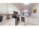 Open concept kitchen with stainless steel appliances and granite countertops at 3322 Purple Martin Dr # 126, Punta Gorda, FL 33950