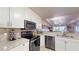Open concept kitchen with stainless steel appliances and granite countertops at 3322 Purple Martin Dr # 126, Punta Gorda, FL 33950