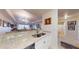 Open kitchen with granite countertops, stainless steel appliances, and breakfast bar at 3322 Purple Martin Dr # 126, Punta Gorda, FL 33950