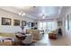 Open concept living and dining area with access to balcony at 3322 Purple Martin Dr # 126, Punta Gorda, FL 33950
