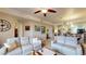 Open living space with two sofas and view of kitchen at 3322 Purple Martin Dr # 126, Punta Gorda, FL 33950