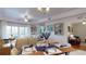 Open concept living and dining area with views to balcony at 3322 Purple Martin Dr # 126, Punta Gorda, FL 33950