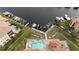 Community pool and waterfront view with boat docks at 3322 Purple Martin Dr # 126, Punta Gorda, FL 33950