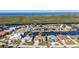 Aerial view showing home's location and canal access at 3411 Curacao Ct, Punta Gorda, FL 33950