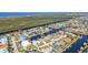 An aerial view showcasing the home's waterfront location and neighborhood at 3411 Curacao Ct, Punta Gorda, FL 33950