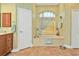 Relaxing bathroom with soaking tub and neutral color scheme at 3411 Curacao Ct, Punta Gorda, FL 33950