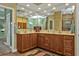 Large bathroom with dual vanities and a walk-in shower at 3411 Curacao Ct, Punta Gorda, FL 33950