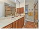 Updated bathroom with a large vanity, double sinks, and a walk-in shower at 3411 Curacao Ct, Punta Gorda, FL 33950
