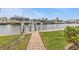 Brick pathway leading to a private boat dock at 3411 Curacao Ct, Punta Gorda, FL 33950