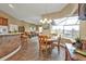 Kitchen dining area with a table for four, view of the canal and lanai access at 3411 Curacao Ct, Punta Gorda, FL 33950
