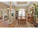 Elegant dining room with a large table, chandelier, and hardwood floors at 3411 Curacao Ct, Punta Gorda, FL 33950