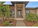 Inviting entryway with a glass front door and tiled floor at 3411 Curacao Ct, Punta Gorda, FL 33950