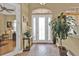 Bright and airy foyer with tiled floors and natural light at 3411 Curacao Ct, Punta Gorda, FL 33950