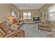 Relaxing Gathering room with leather furniture and neutral color palette at 3411 Curacao Ct, Punta Gorda, FL 33950