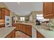 Modern kitchen with a large island, lots of counter space, and views of the backyard at 3411 Curacao Ct, Punta Gorda, FL 33950
