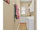 Bright laundry room with washer, dryer and storage at 3411 Curacao Ct, Punta Gorda, FL 33950