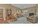 Relaxing living room featuring comfortable seating and a large TV at 3411 Curacao Ct, Punta Gorda, FL 33950
