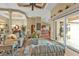Spacious living room with tile floors, comfy furniture, and access to a lanai at 3411 Curacao Ct, Punta Gorda, FL 33950