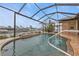 Inviting kidney-shaped pool with a screened enclosure at 3411 Curacao Ct, Punta Gorda, FL 33950