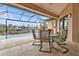 Relaxing covered patio with pool and canal views at 3411 Curacao Ct, Punta Gorda, FL 33950
