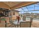 Covered patio overlooking the canal and pool at 3411 Curacao Ct, Punta Gorda, FL 33950