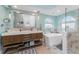 Spa-like bathroom with double vanity and large soaking tub at 3412 Nighthawk Ct, Punta Gorda, FL 33950