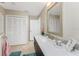 Bathroom boasts a large vanity, linen closet and stylish flooring at 3412 Nighthawk Ct, Punta Gorda, FL 33950