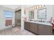 Elegant bathroom with double vanity and walk-in shower at 3412 Nighthawk Ct, Punta Gorda, FL 33950