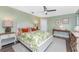 Guest bedroom with a queen-size bed and light-colored furniture at 3412 Nighthawk Ct, Punta Gorda, FL 33950