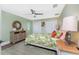 Relaxing bedroom with a tropical-themed bed and ceiling fan at 3412 Nighthawk Ct, Punta Gorda, FL 33950