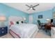 Comfortable bedroom with king-size bed, home office, and ceiling fan at 3412 Nighthawk Ct, Punta Gorda, FL 33950