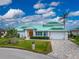 Stunning waterfront home with a metal roof and meticulously landscaped lawn at 3412 Nighthawk Ct, Punta Gorda, FL 33950