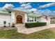 Elegant entryway with double doors and stone walkway at 3412 Nighthawk Ct, Punta Gorda, FL 33950