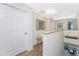 Upstairs hallway with wood flooring and neutral wall colors at 3412 Nighthawk Ct, Punta Gorda, FL 33950