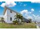 White house with landscaping and canal side yard at 3412 Nighthawk Ct, Punta Gorda, FL 33950