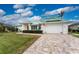 Attractive single-story home with green roof and paver driveway at 3412 Nighthawk Ct, Punta Gorda, FL 33950