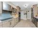 Modern kitchen with stainless steel appliances and a farmhouse sink at 3412 Nighthawk Ct, Punta Gorda, FL 33950