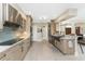 Modern kitchen with stainless steel appliances and a farmhouse sink at 3412 Nighthawk Ct, Punta Gorda, FL 33950