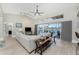 L-shaped sectional sofa, water view, and wet bar at 3412 Nighthawk Ct, Punta Gorda, FL 33950