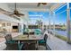 Enclosed patio with pool, dining area, and view of the canal at 3412 Nighthawk Ct, Punta Gorda, FL 33950