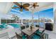 Relaxing pool area with patio furniture, screened enclosure, and water view at 3412 Nighthawk Ct, Punta Gorda, FL 33950