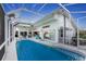 Relaxing pool with screened enclosure, canal view, and access to home at 3412 Nighthawk Ct, Punta Gorda, FL 33950