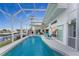 Large, refreshing pool with screened enclosure and canal views at 3412 Nighthawk Ct, Punta Gorda, FL 33950