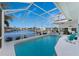 Enjoy this refreshing pool with screened enclosure and stunning canal views at 3412 Nighthawk Ct, Punta Gorda, FL 33950