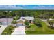 Aerial view of a lovely home with mature trees and beautiful landscaping at 4267 Adelaide Ave, North Port, FL 34288